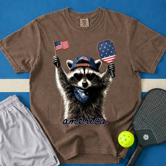 May include Feral & Pickleball T-Shirt in espresso t-shirt with Feral & Free Raccoon design