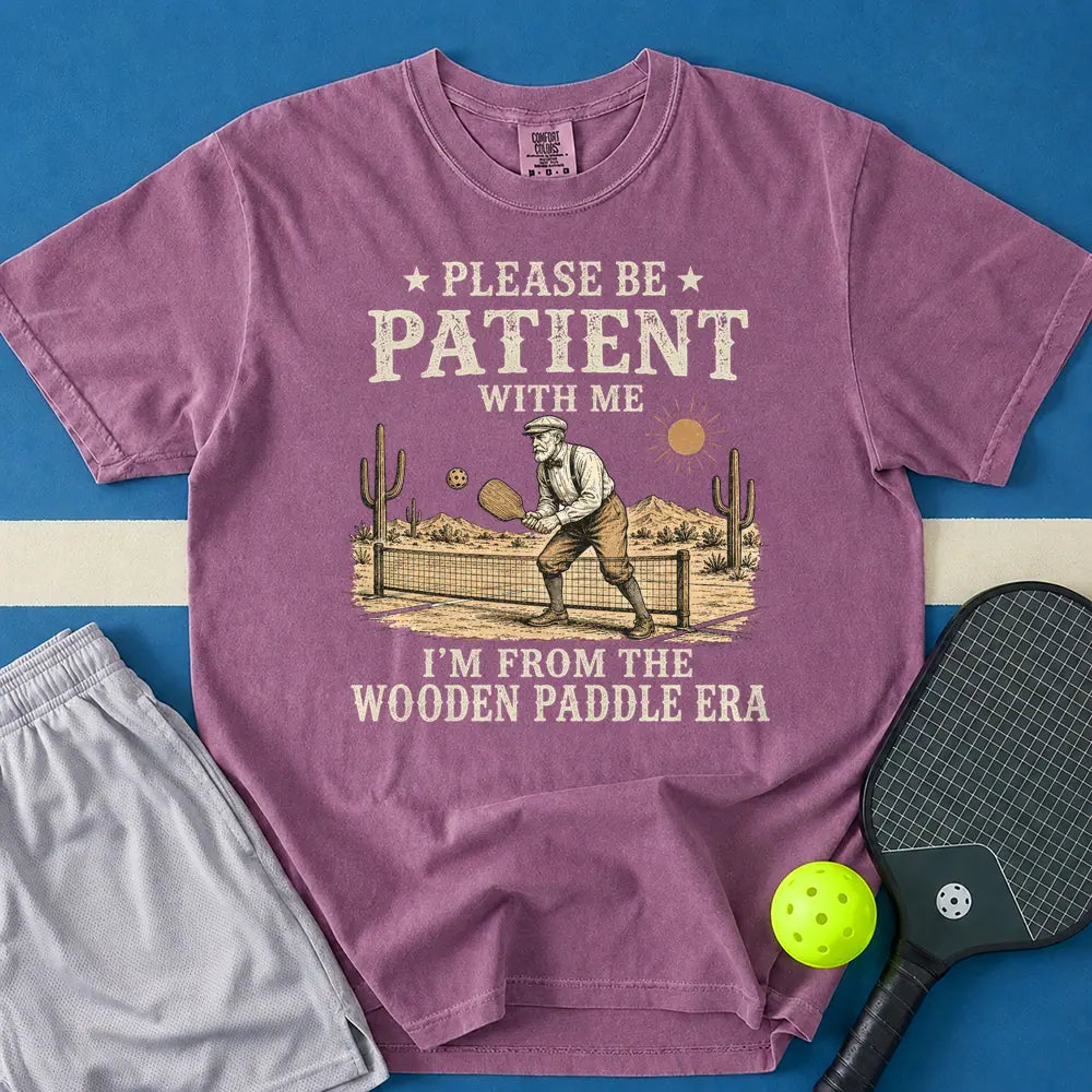 May include Be Patient With Me Wooden Paddle Era T-Shirt in berry t-shirt with Be Patient With Me Wooden Paddle Era design