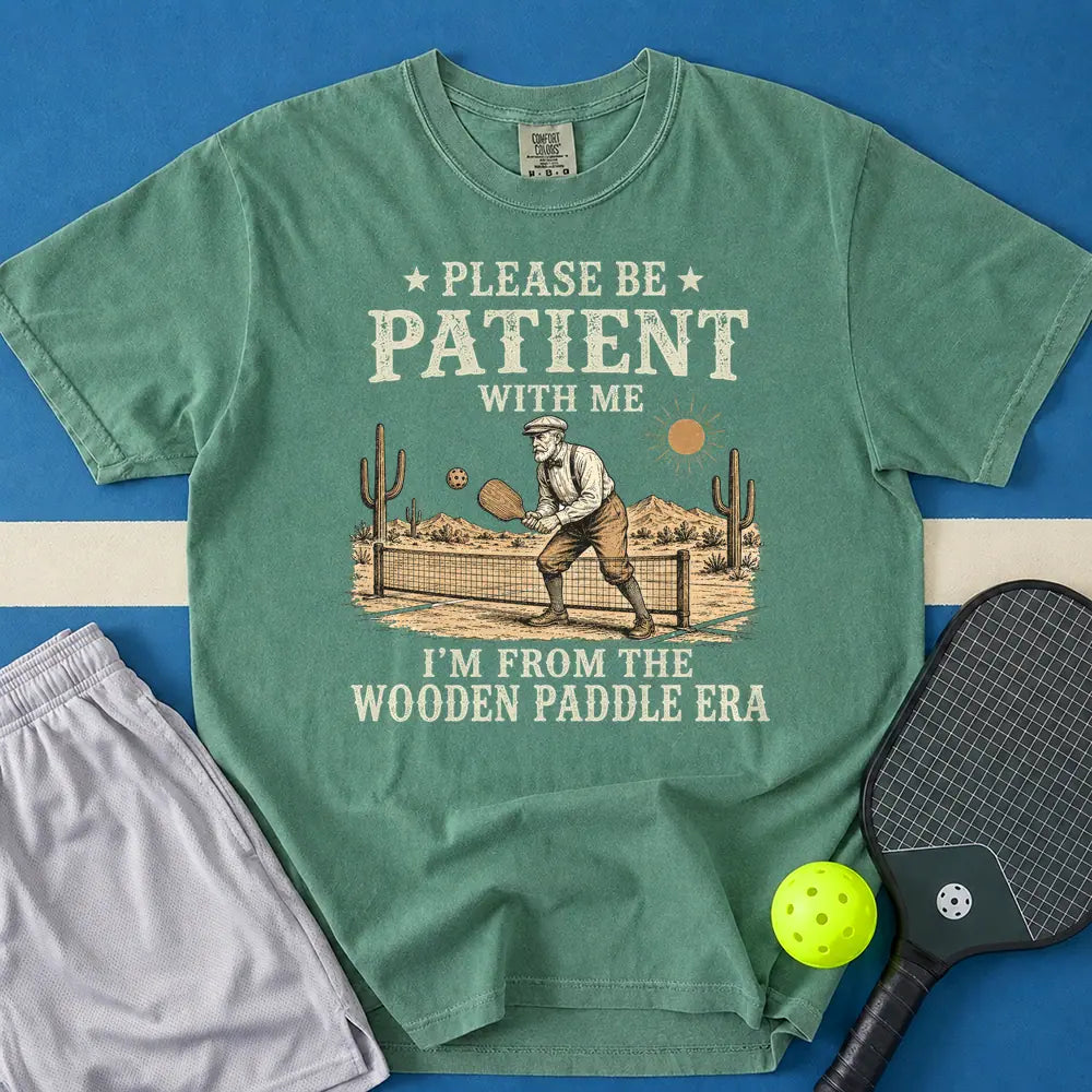 May include Be Patient With Me Wooden Paddle Era T-Shirt in light green t-shirt with Be Patient With Me Wooden Paddle Era design