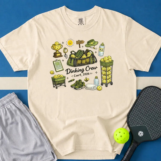 May include Dinking Crew T-Shirt in ivory t-shirt with Dinking Crew design