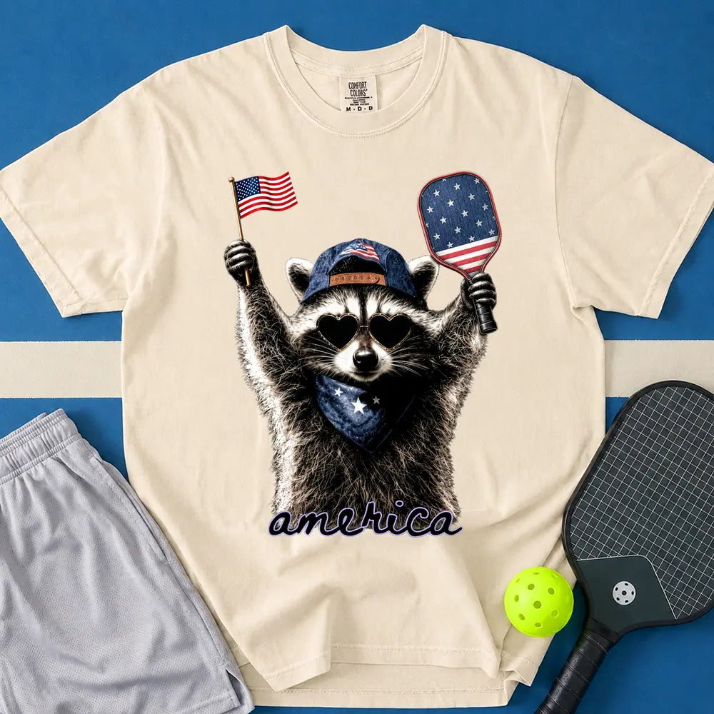 May include Feral & Pickleball T-Shirt in ivory t-shirt with Feral & Free Raccoon design