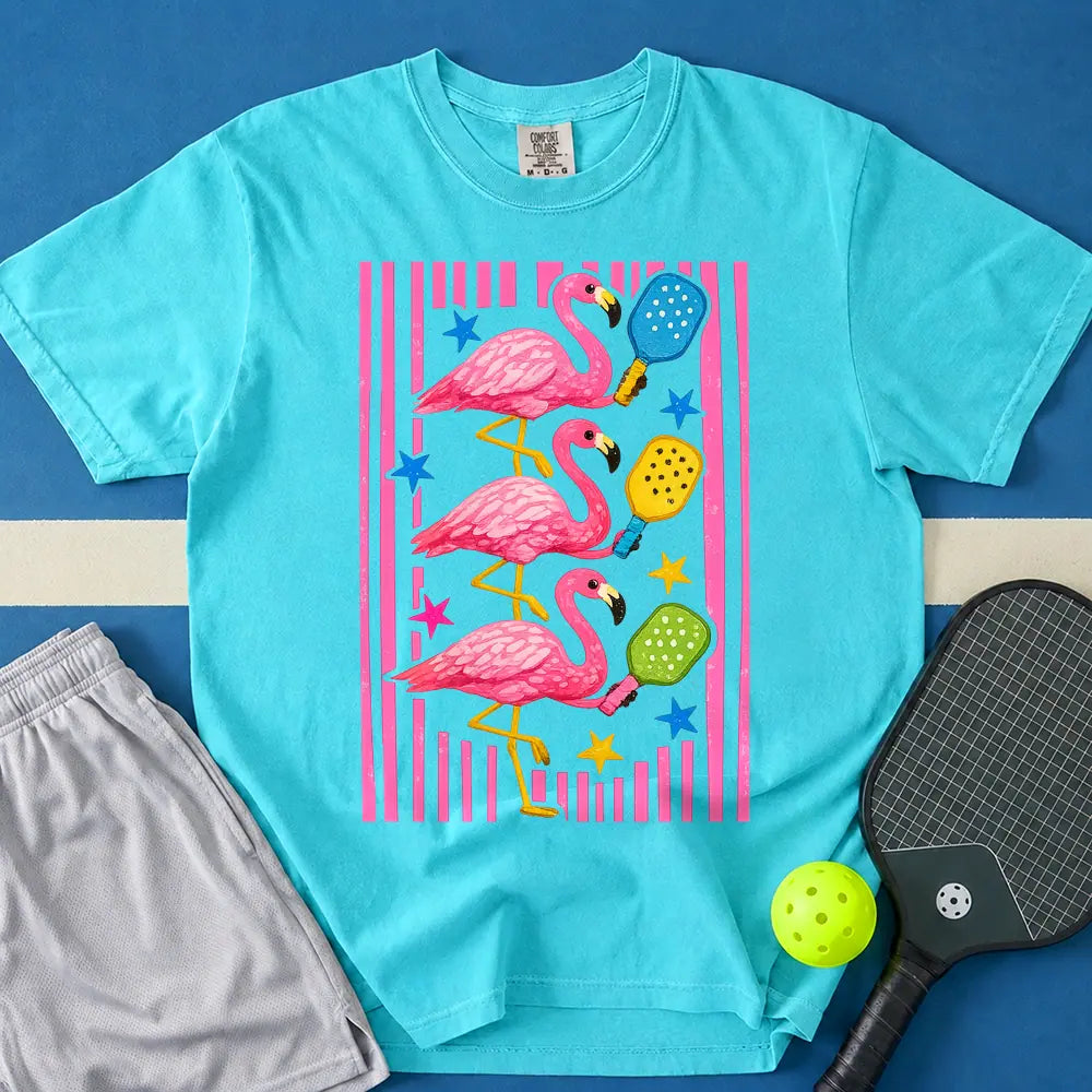 May include Flamingos Paddles T-Shirt in lagoon t-shirt with Flamingos Paddles design