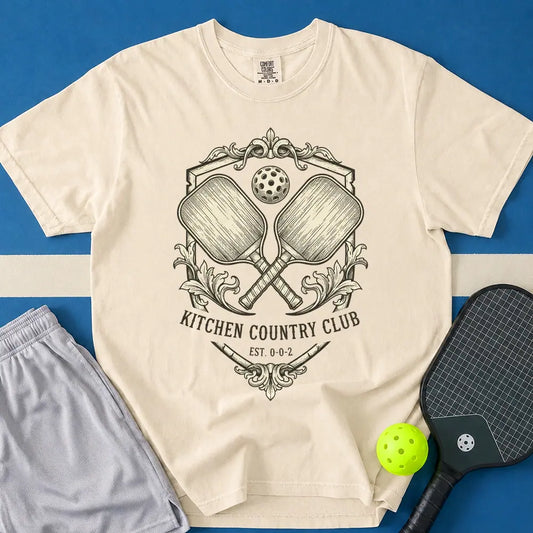 May include Kitchen Country Club T-Shirt in ivory t-shirt with Kitchen Country Club design