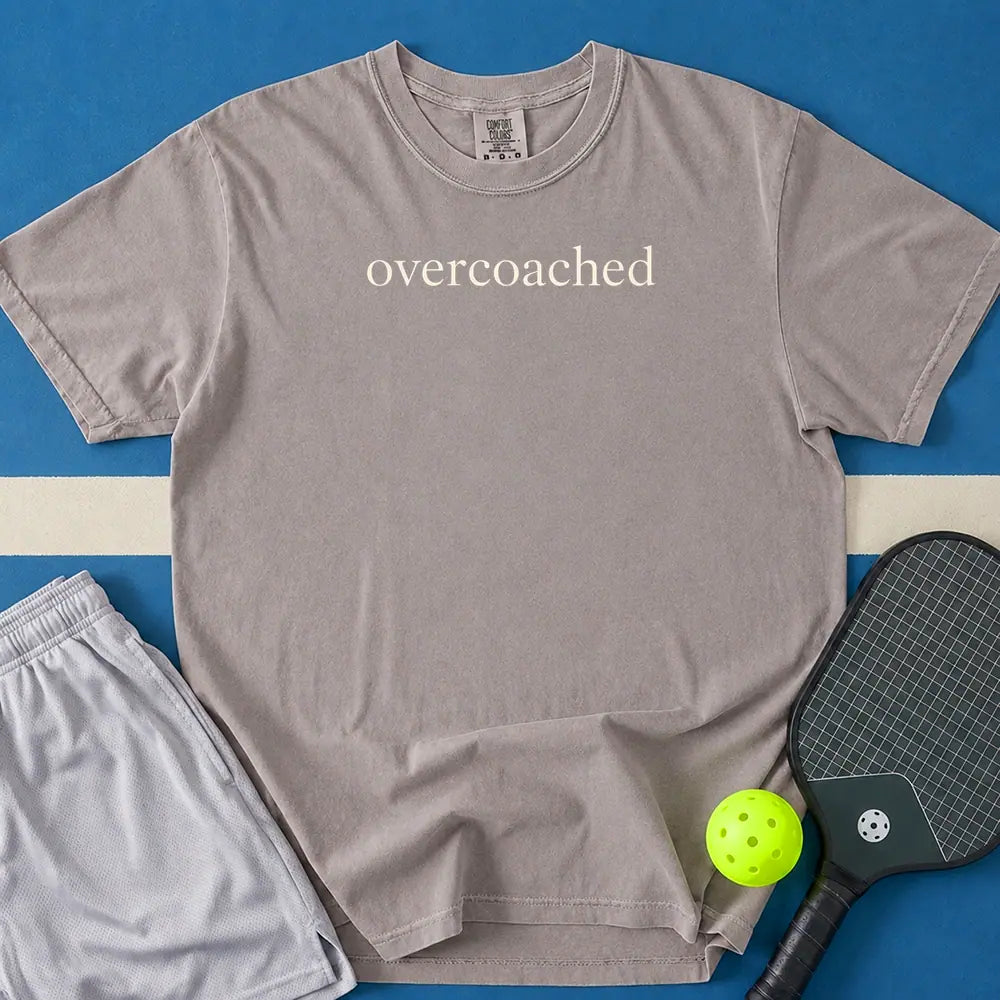 May include Overcoached T-Shirt in gray t-shirt with Overcoached design