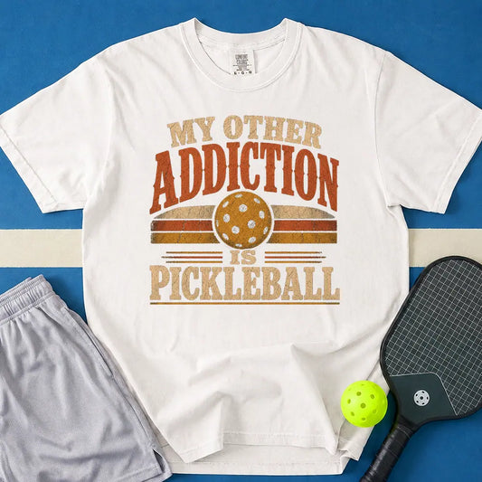 May include Pickleball Addiction T-Shirt in white t-shirt with Pickleball Addiction design