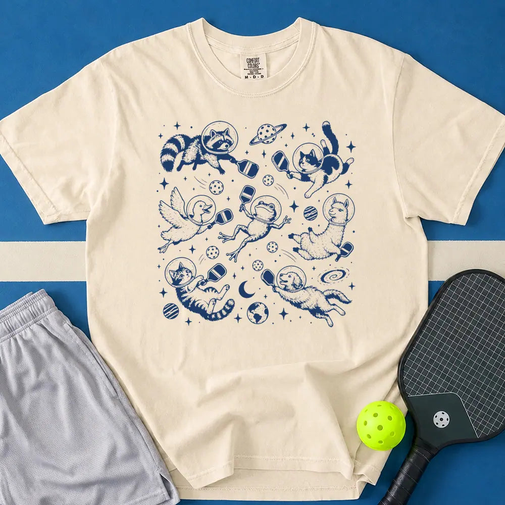May include Space Pickleball T-Shirt in ivory t-shirt with Space Pickleball design