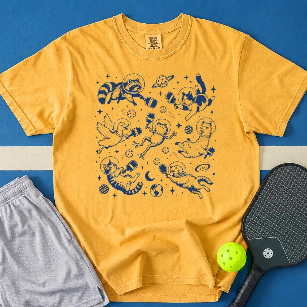 May include Space Pickleball T-Shirt in mustard t-shirt with Space Pickleball design