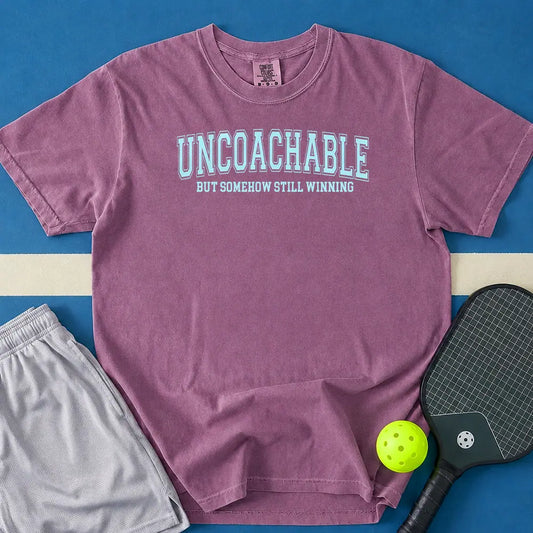 May include Uncoachable But Somehow Still Winning T-Shirt in berry t-shirt with Uncoachable But Somehow Still Winning design