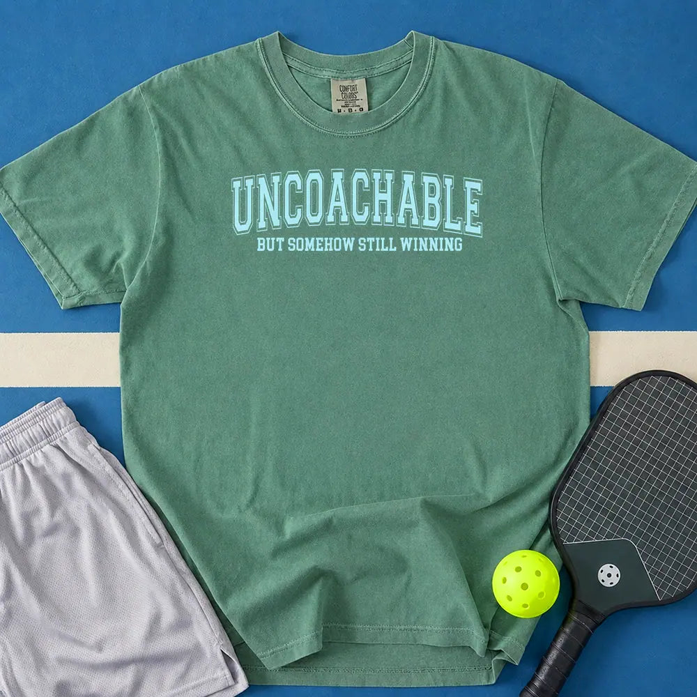 May include Uncoachable But Somehow Still Winning T-Shirt in light green t-shirt with Uncoachable But Somehow Still Winning design