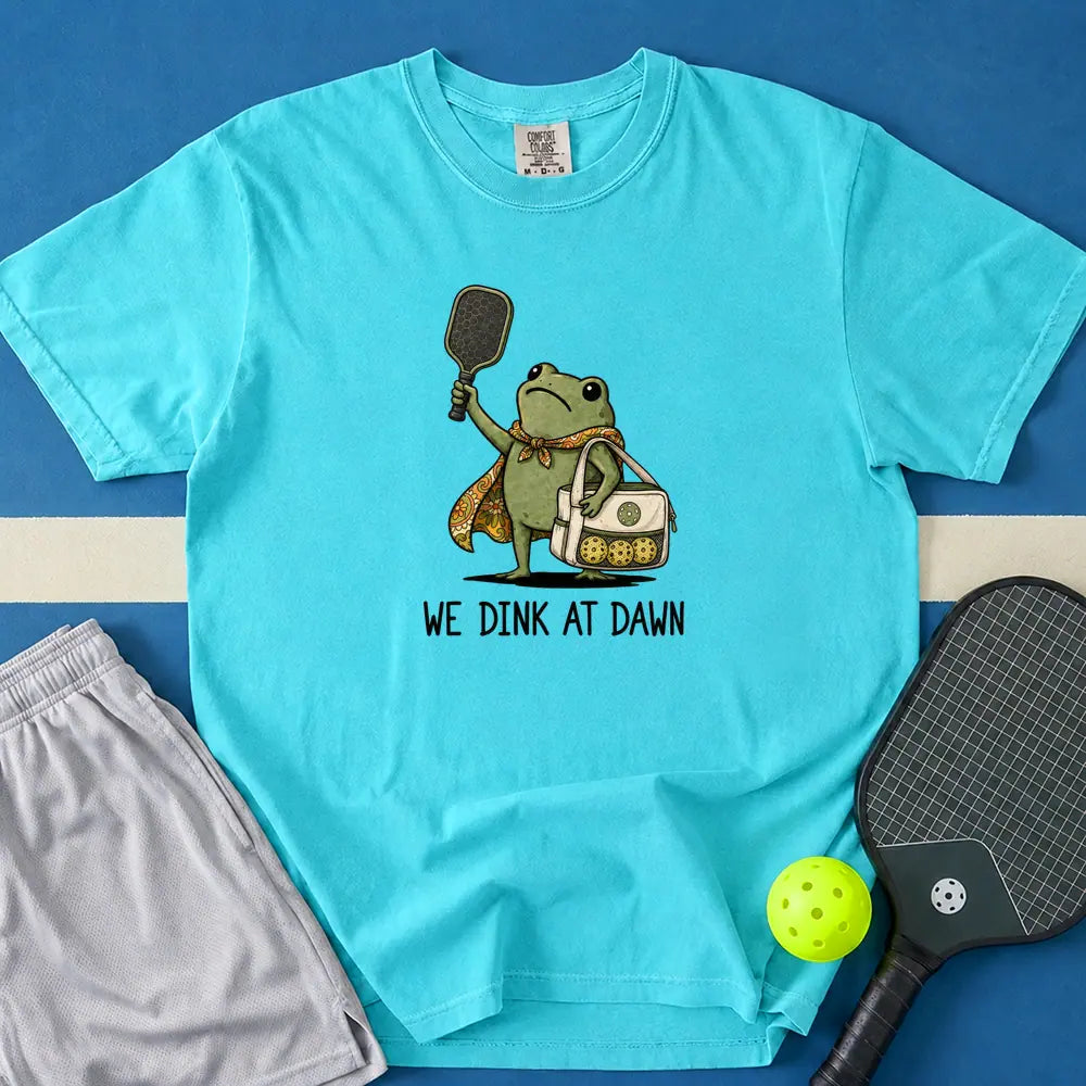 May include We Dink At Dawn T-Shirt in lagoon t-shirt with We Dink At Dawn design