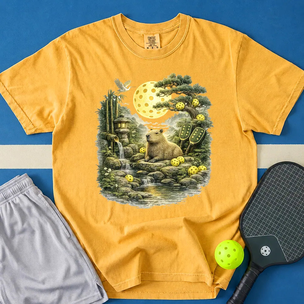 May include Zen Capybara T-Shirt in mustard t-shirt with Zen Capybara design